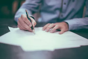 Signing legal paperwork — divorce solicitor Liverpool