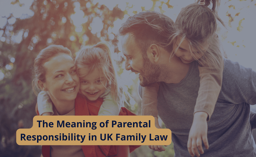 A smiling family of four outdoors, with parents carrying children on their backs, representing the meaning of parental responsibility in UK family law.